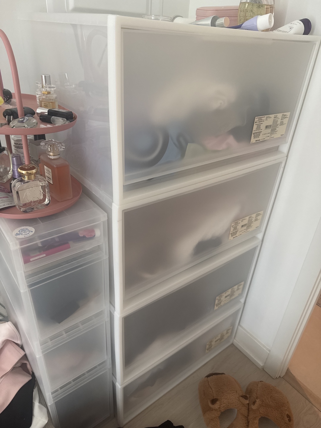 two separate clear plastic storage drawers