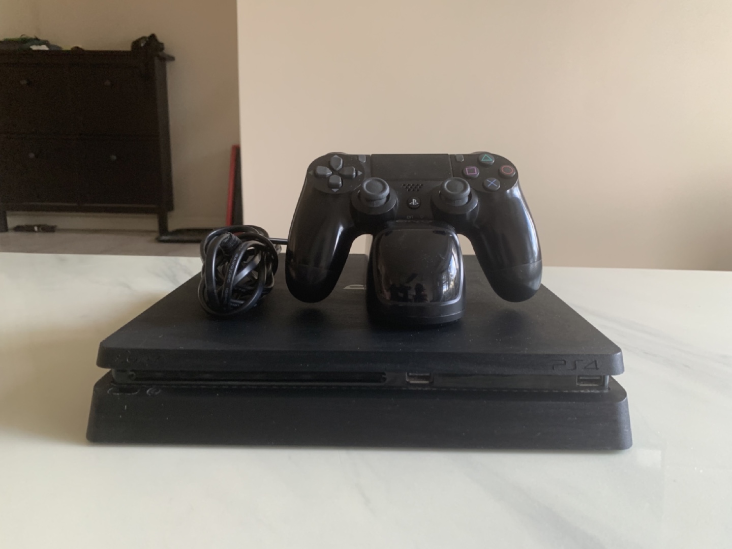 Sony PlayStation Four with controller and charging station