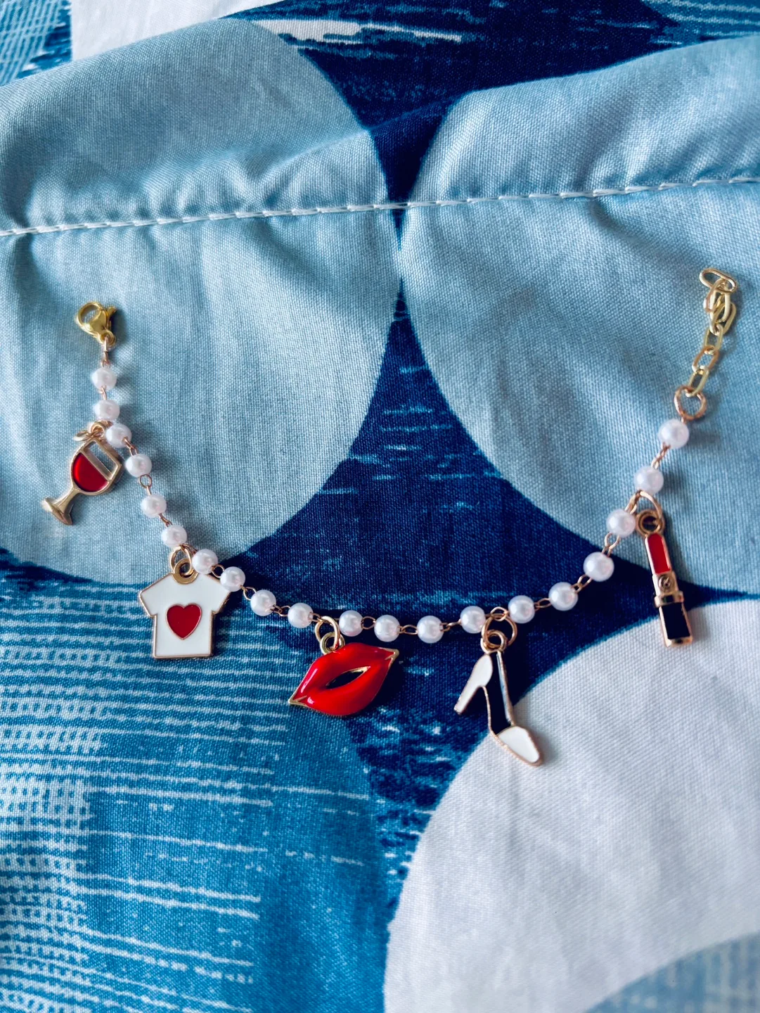 Charming Pearl Bracelet with Red Enamel Charms thumbnail