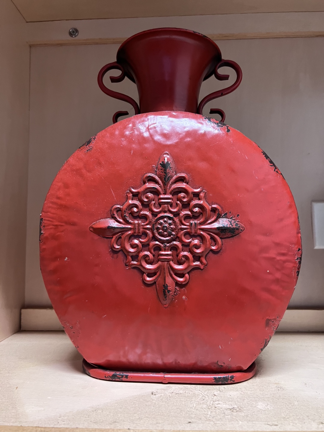 Red Metal Vase with Ornate Design