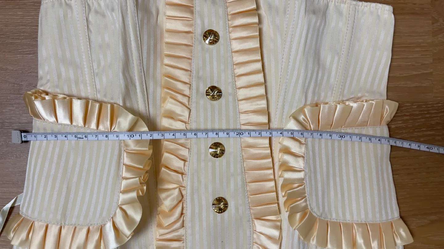 Cream coloured striped corset with ruffles image indicator(5)