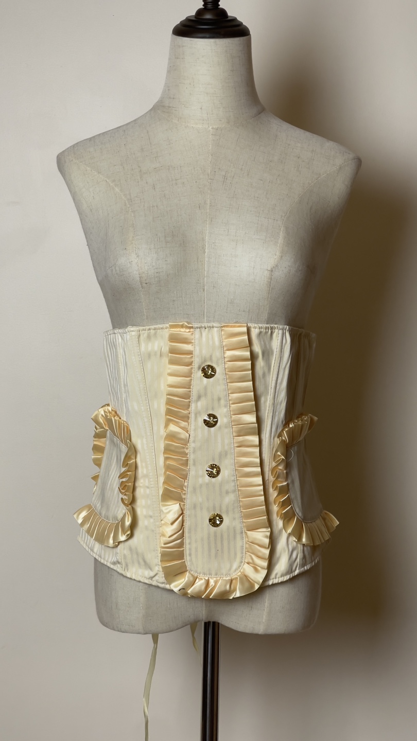 Cream coloured striped corset with ruffles