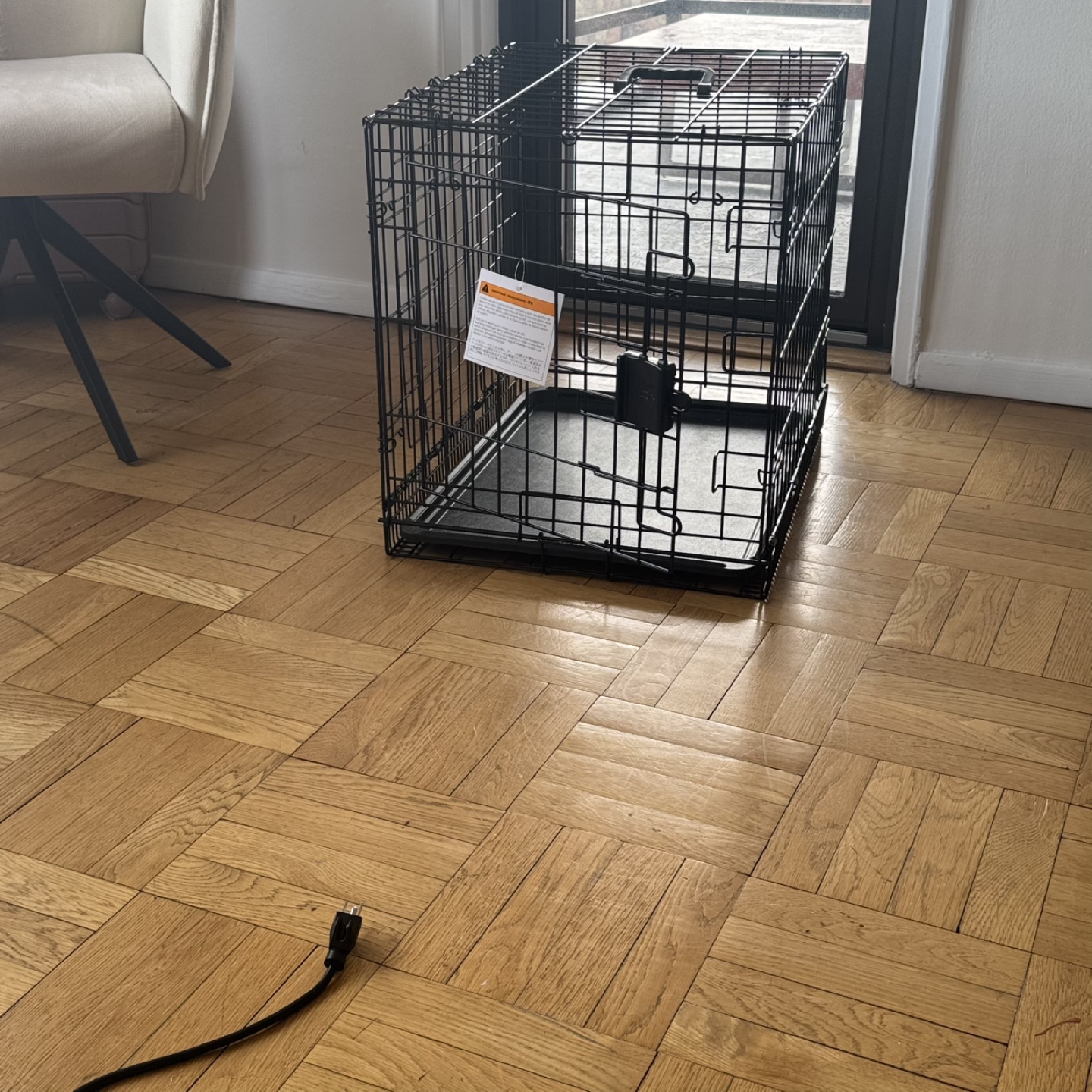 Black wire dog crate with tray