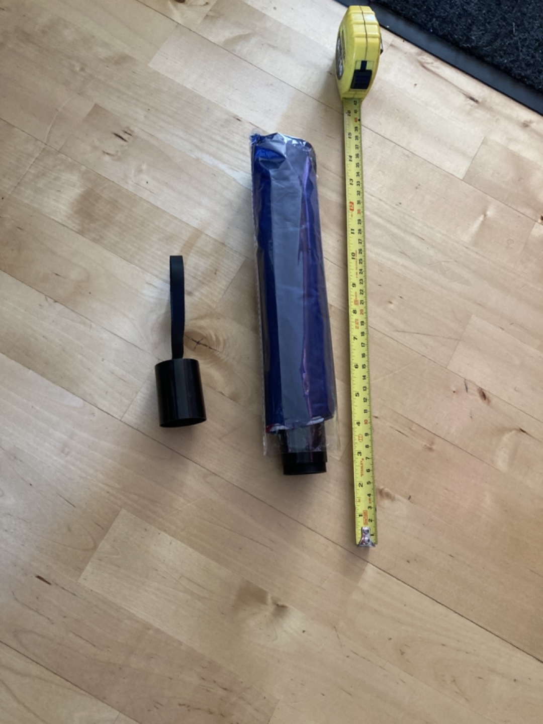 Travel umbrella with hidden compartment