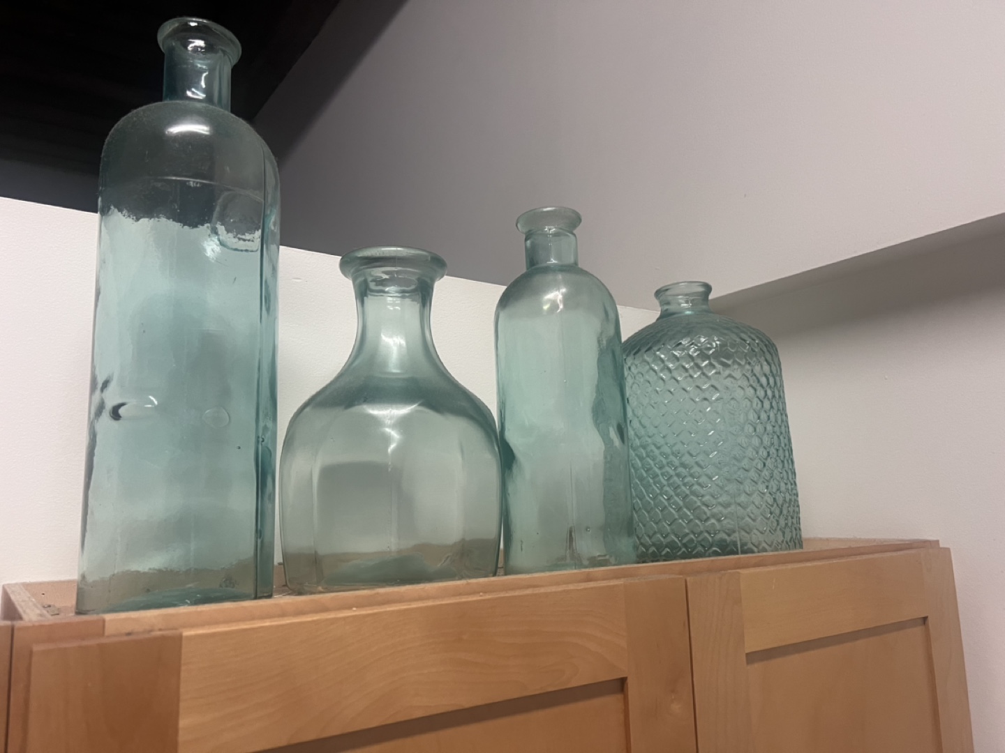 Set of Four Light Teal Glass Bottles