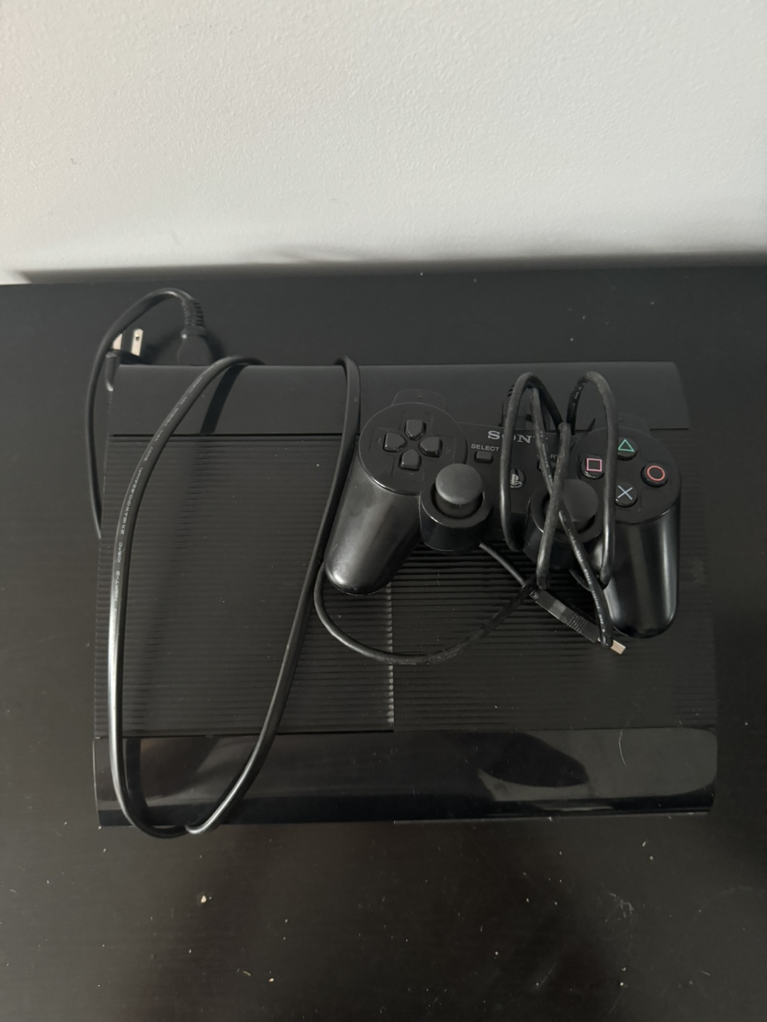 PlayStation 3 with Wireless DualShock 3 and Charger 2012 Release