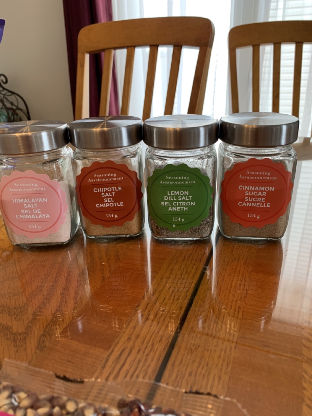 Assortment of Gourmet Popcorn Kernels and Seasoning Jars