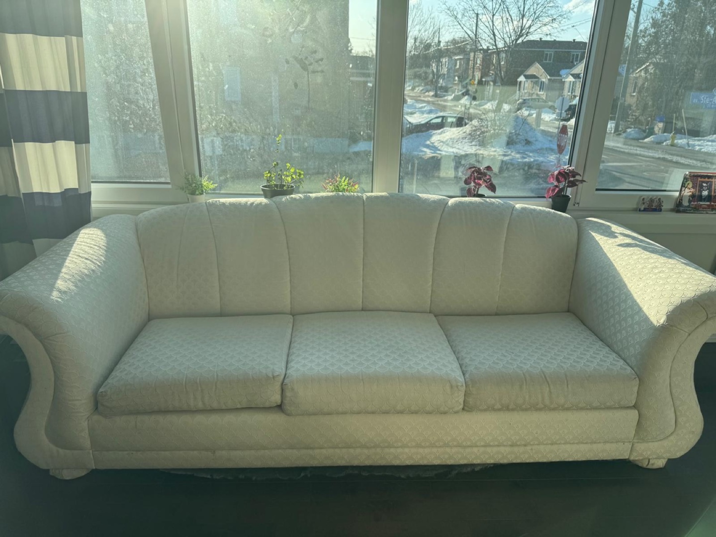Cream-coloured three-seater sofa
