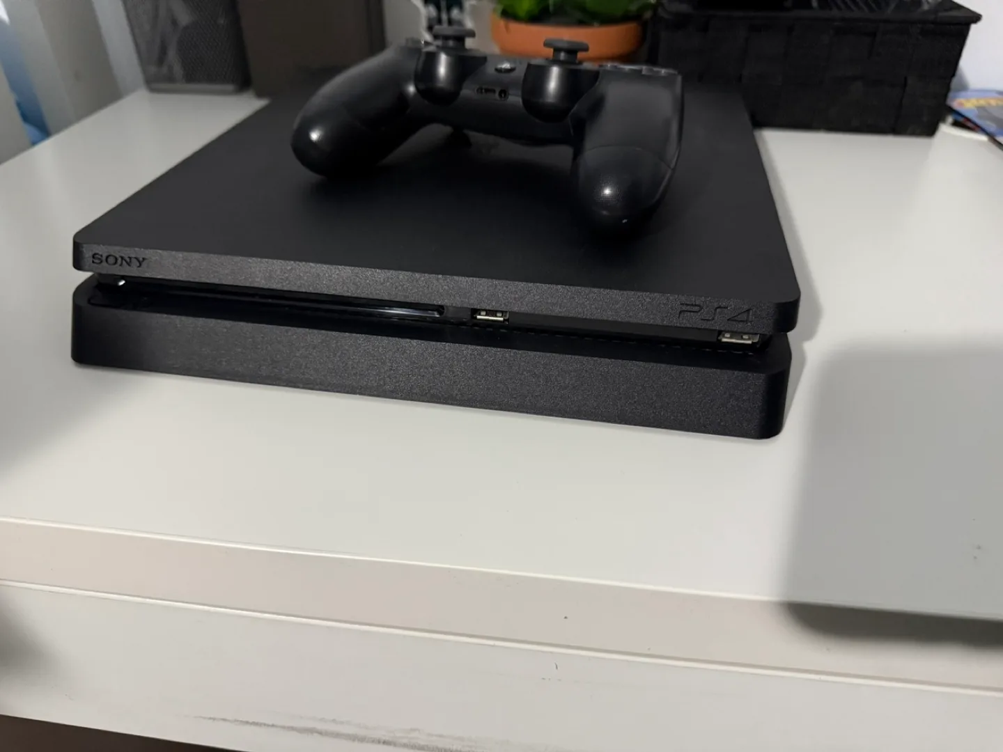 PS4 Slim Console with Black Controller image indicator(4)