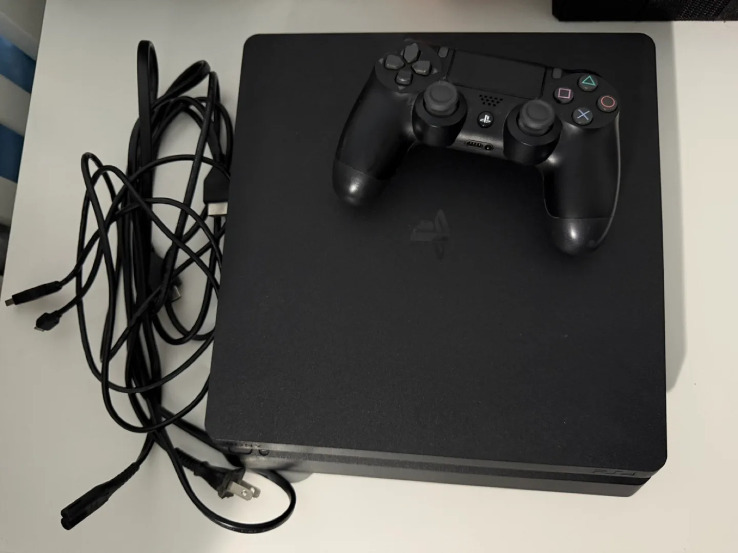 PS4 Slim Console with Black Controller image indicator(6)