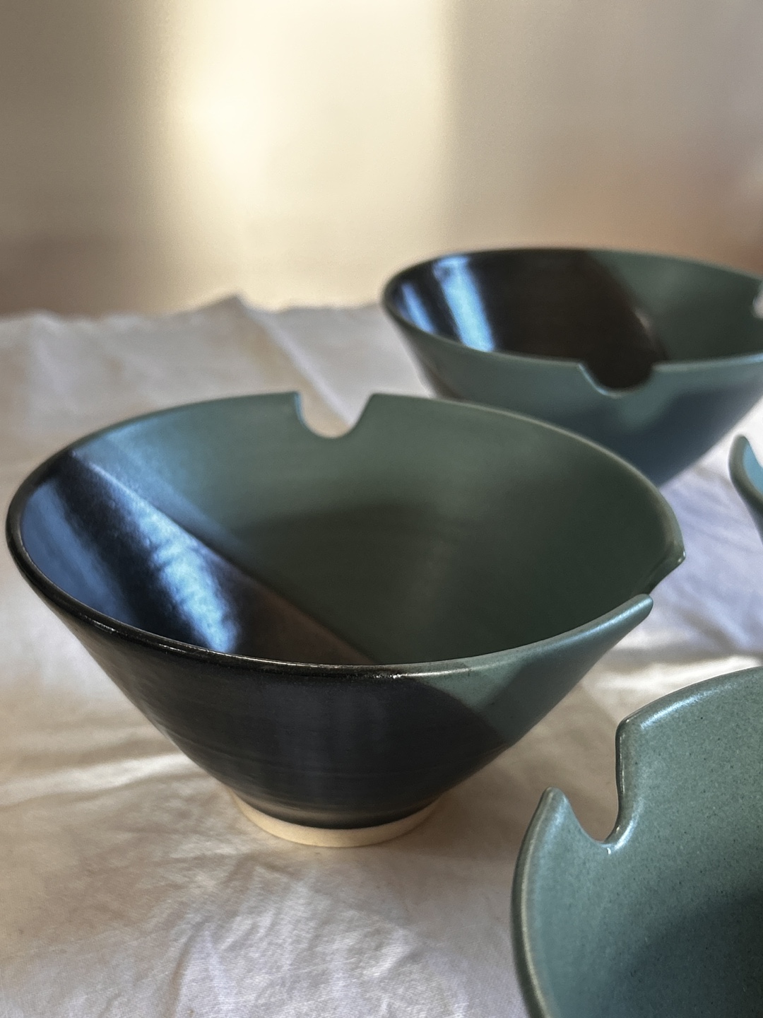 Set of four Peter Price ceramic bowls