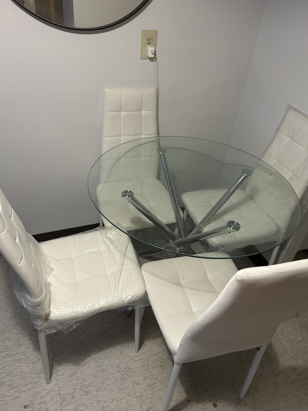 Glass Top Dining Table with Four White Chairs