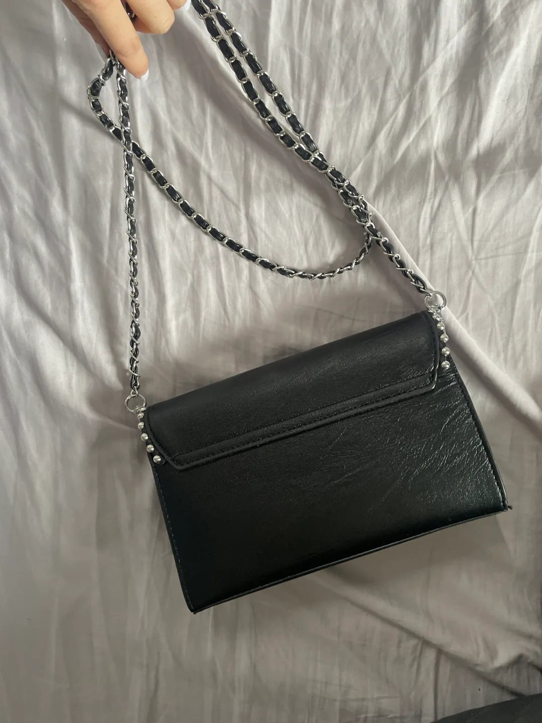 Black studded crossbody bag. Free with any purchase image indicator(5)