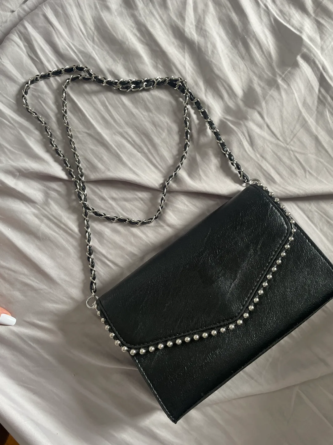 Black studded crossbody bag. Free with any purchase image indicator(4)