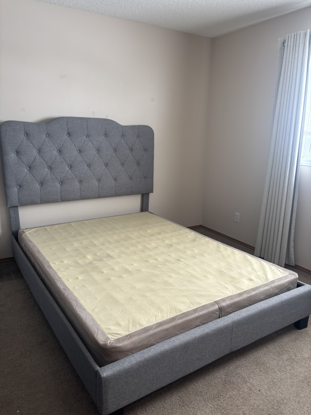 Queen-size upholstered bed frame with adjustable headboard