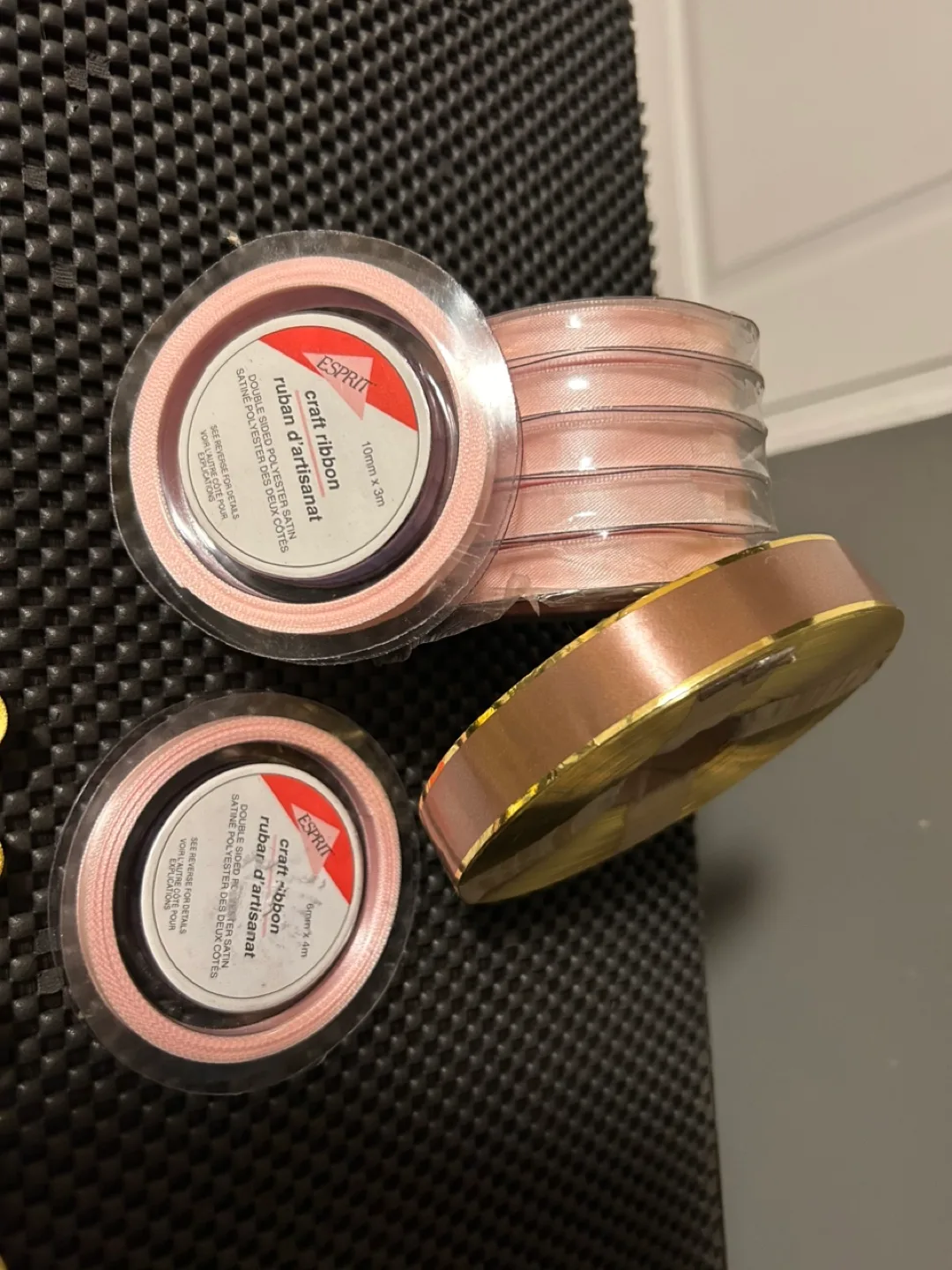 Eight spools of yellow ribbon and two rolls of pink ribbon image indicator(2)