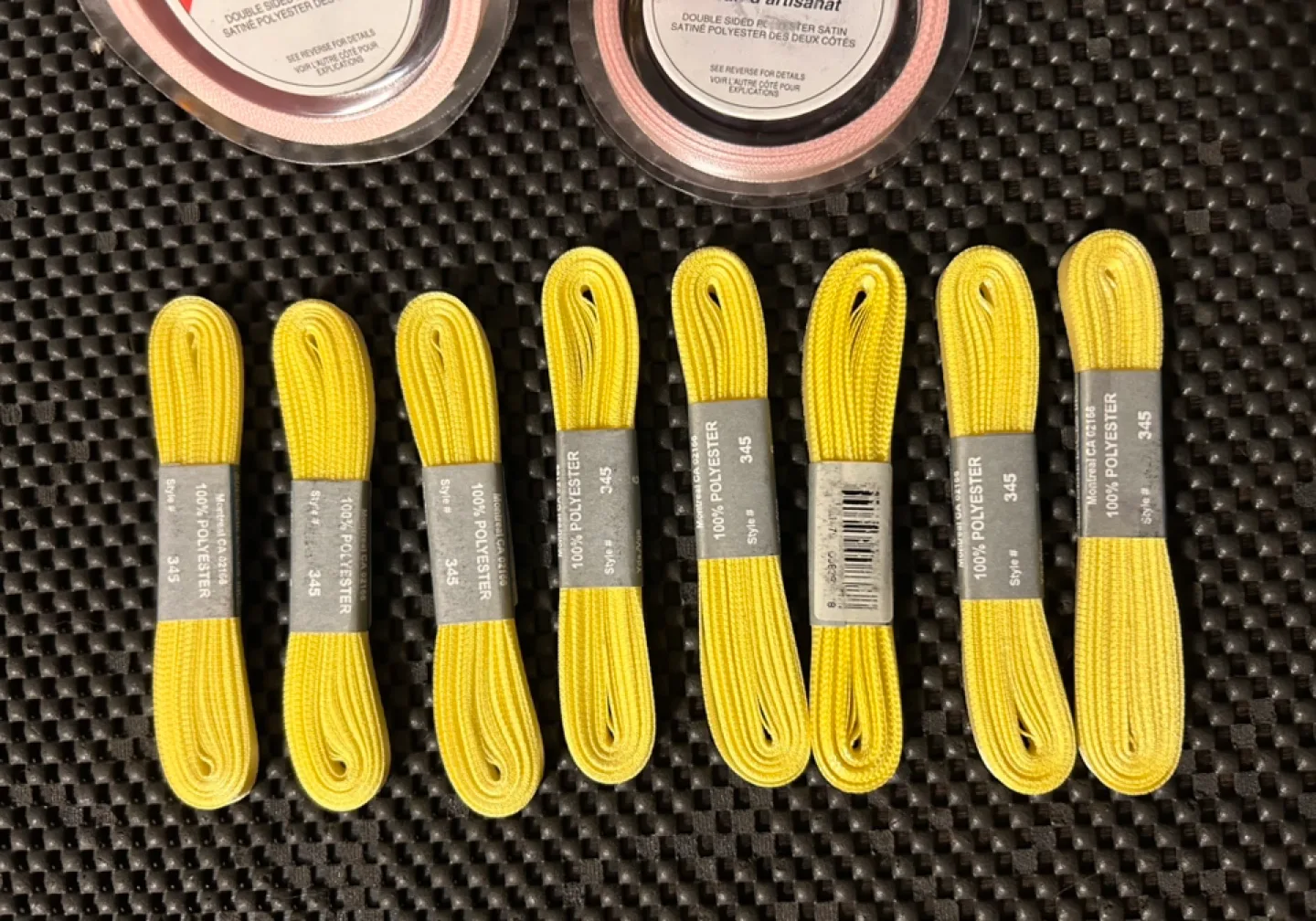Eight spools of yellow ribbon and two rolls of pink ribbon image indicator(3)
