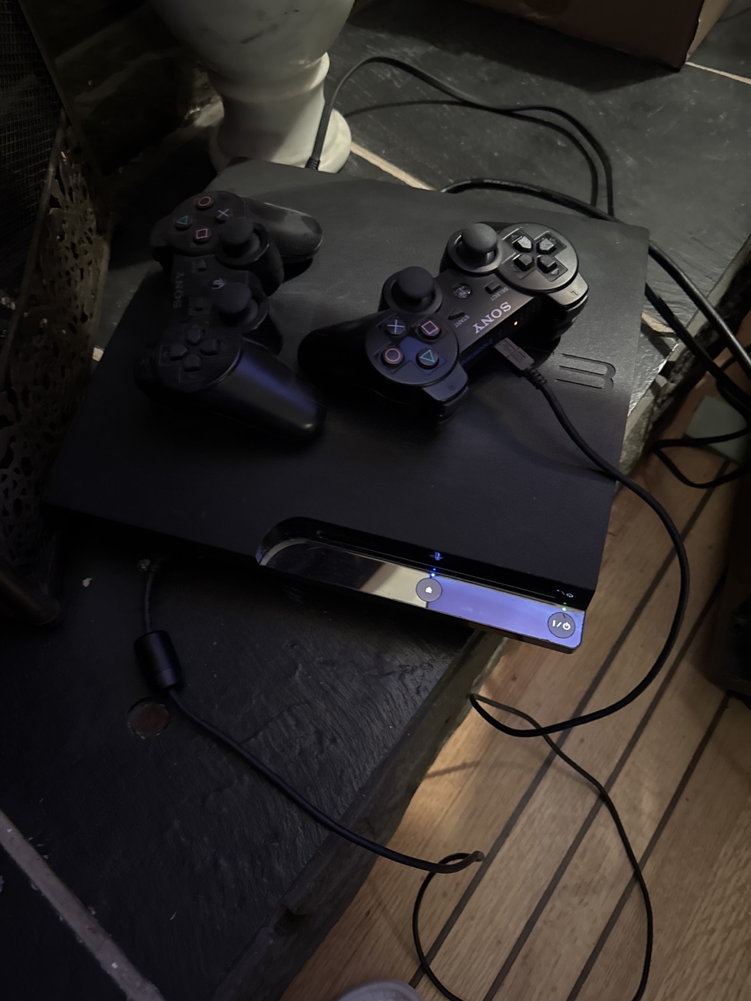 PS3 slim Console with 2 Controllers and 2010 FIFA World Cup Game