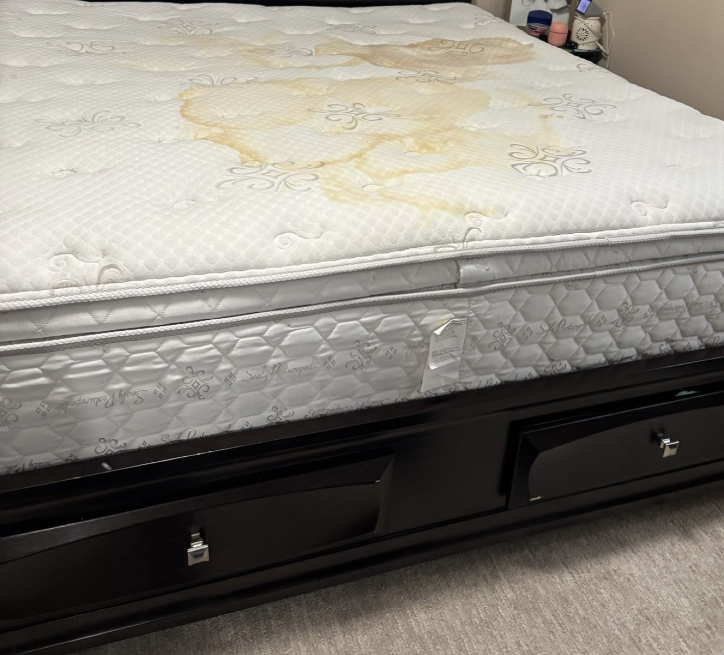 Queen Mattress with Stain in Black Frame