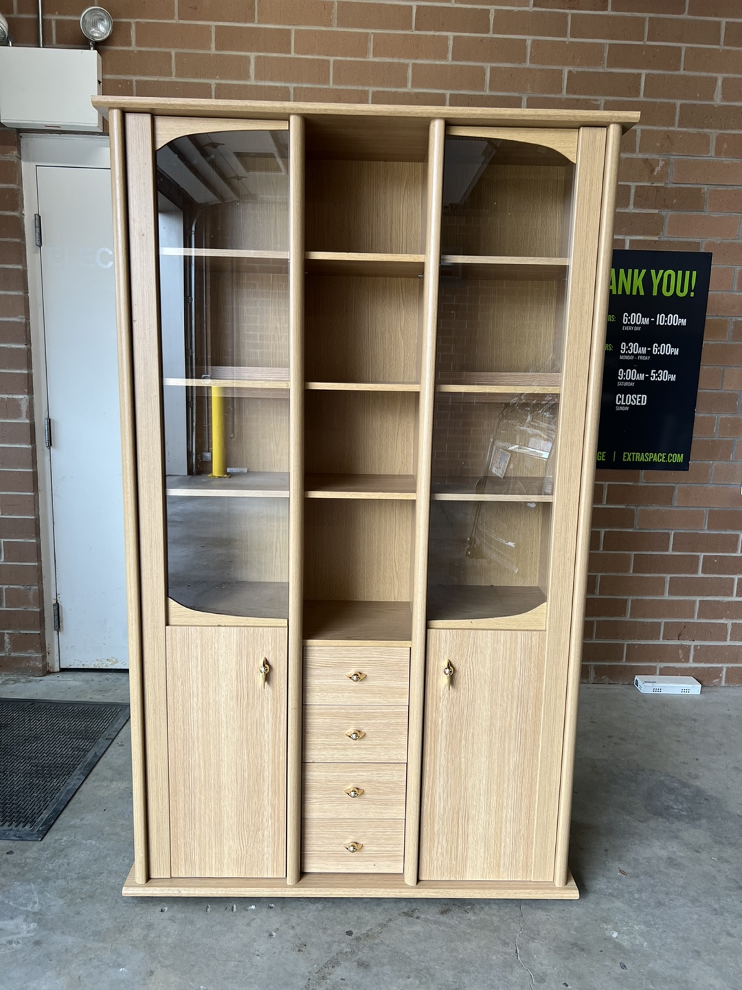 Bookcase w/storage and glass doors.