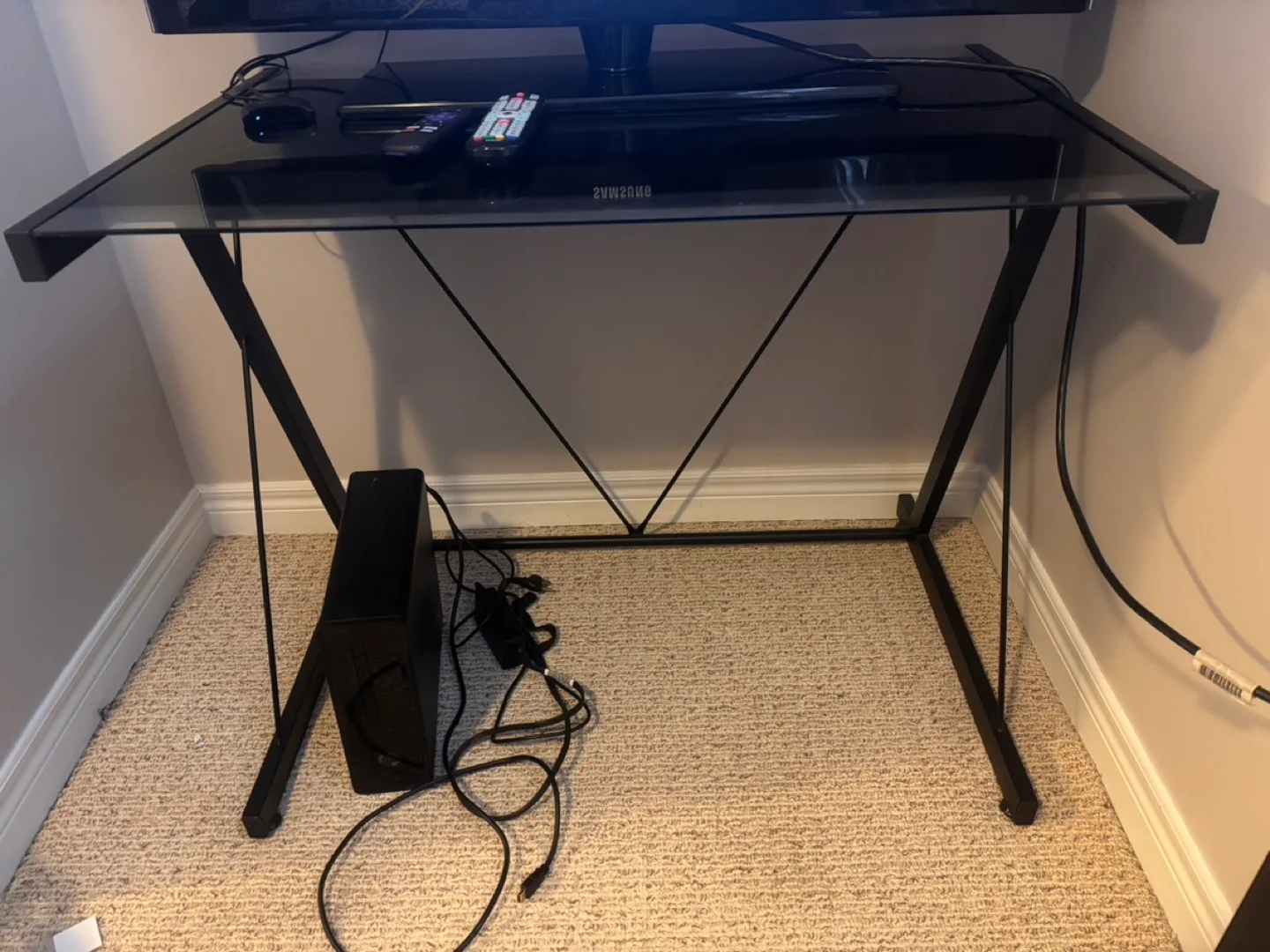 Sleek Black Glass Stand with Metal Frame thumbnail