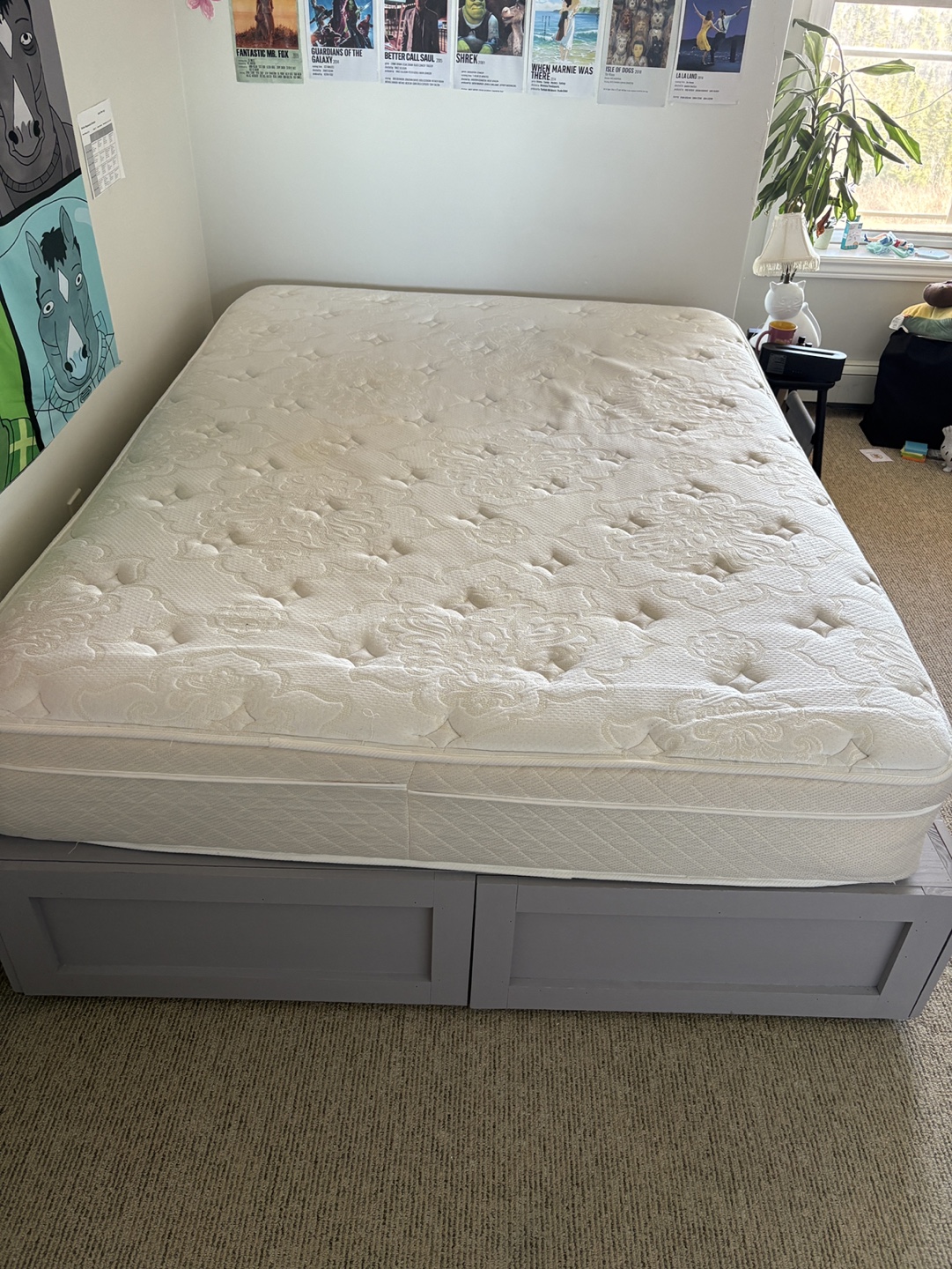 Queen-size bed frame with mattress and storage