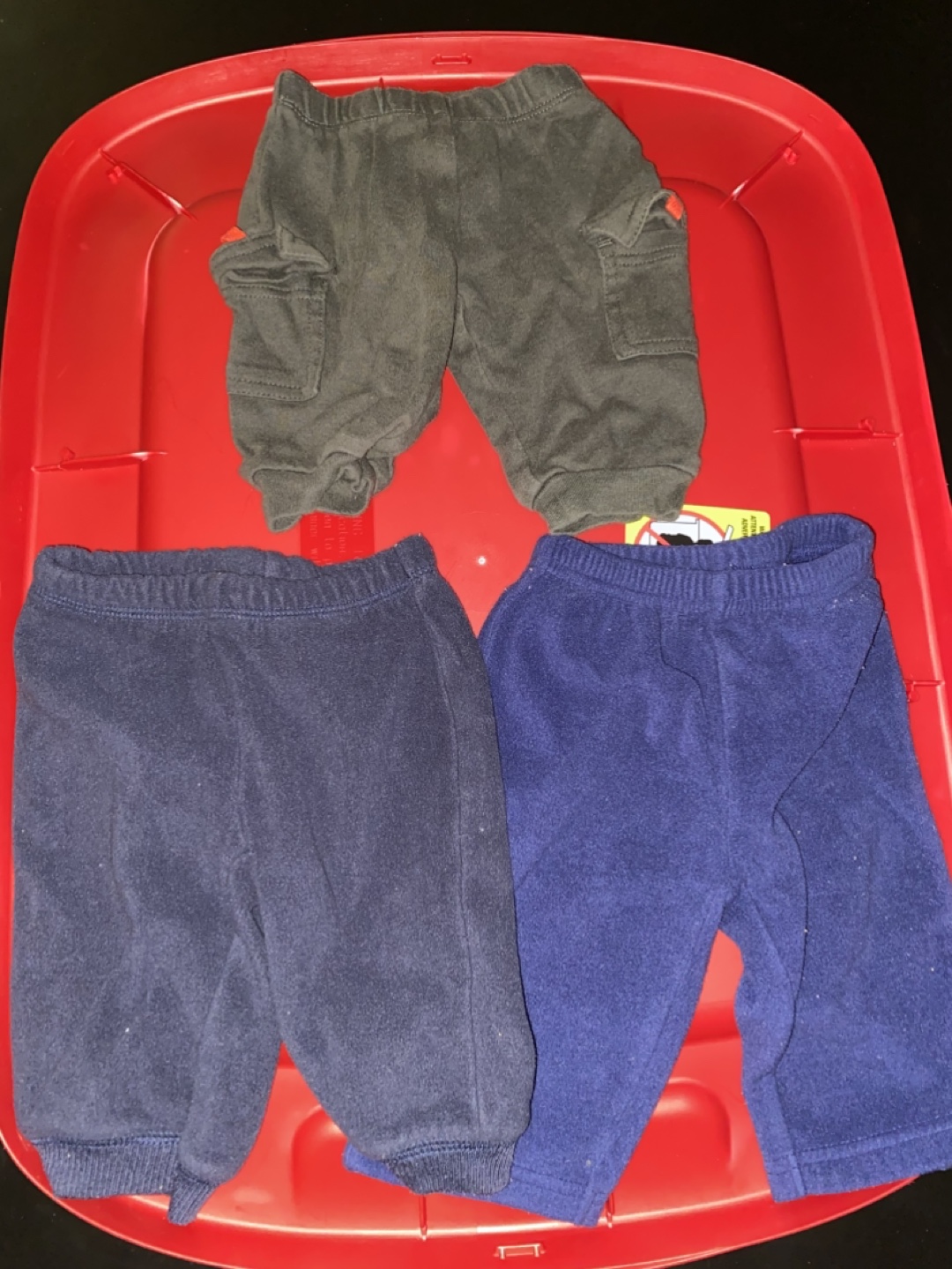 Three pairs of baby boy pants carters