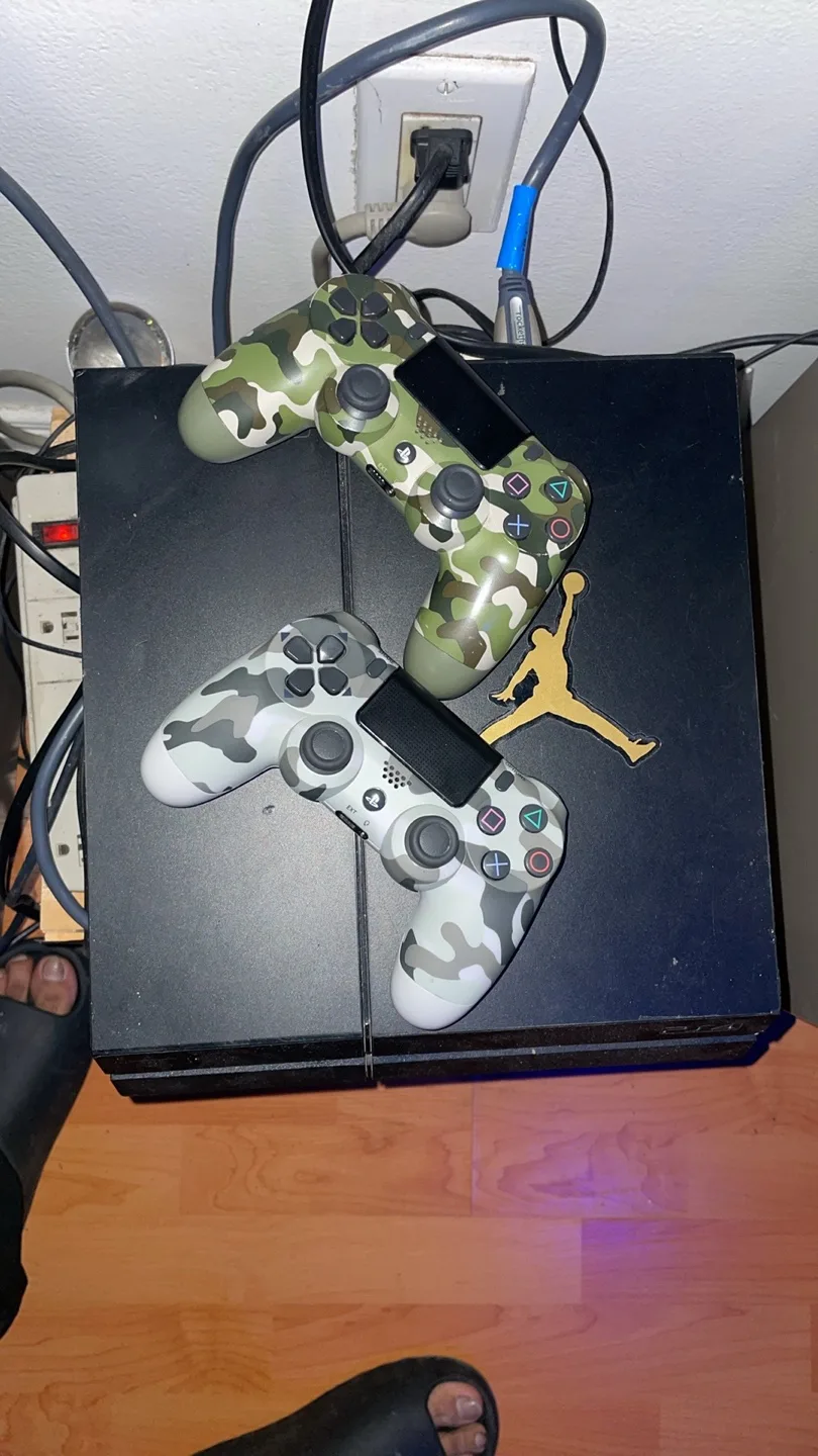 PS4 Console with 2 Camo Controllers & 8 Games thumbnail