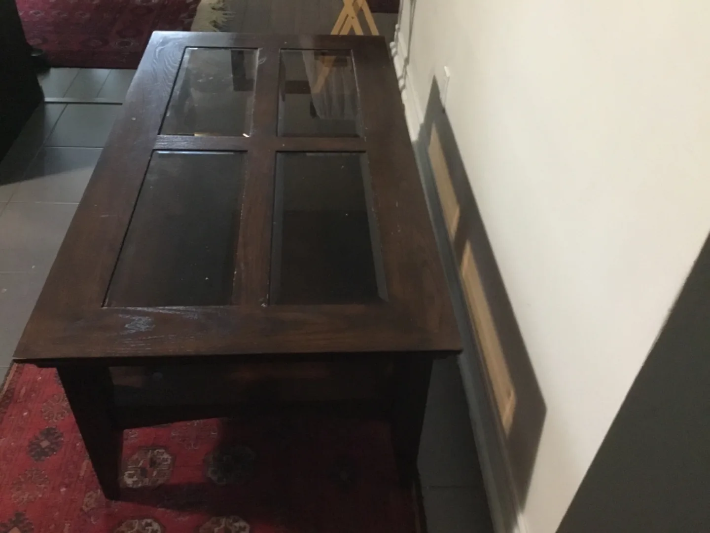 Dark brown wooden coffee table with glass top image indicator(2)