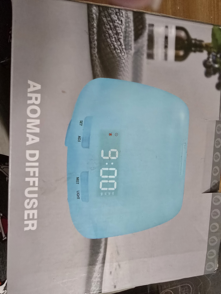 New Aroma Diffuser with 7 Colour Changing LED Lights & Clock