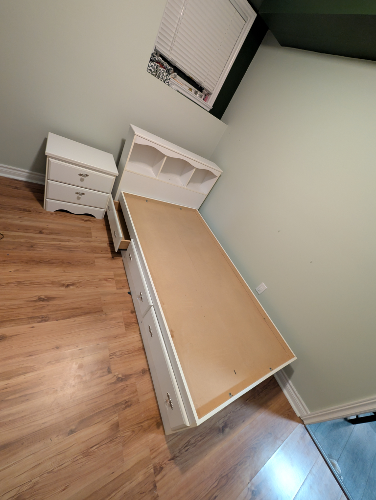White bedroom set: dresser, mirror, bed frame, and nightstand