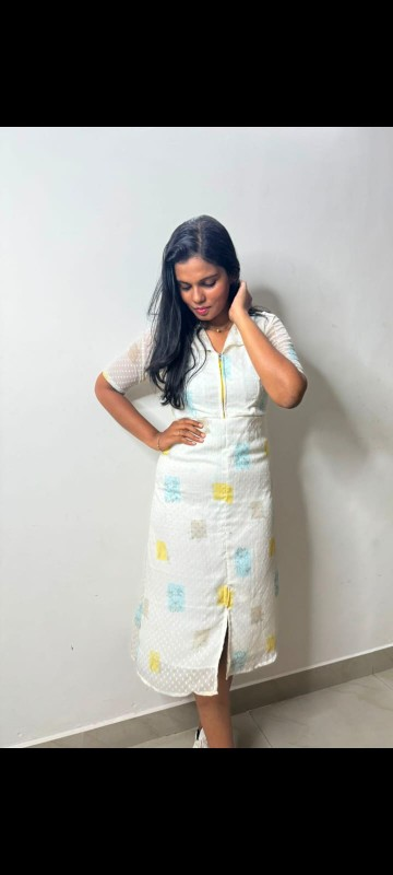 White midi dress with yellow and blue accents