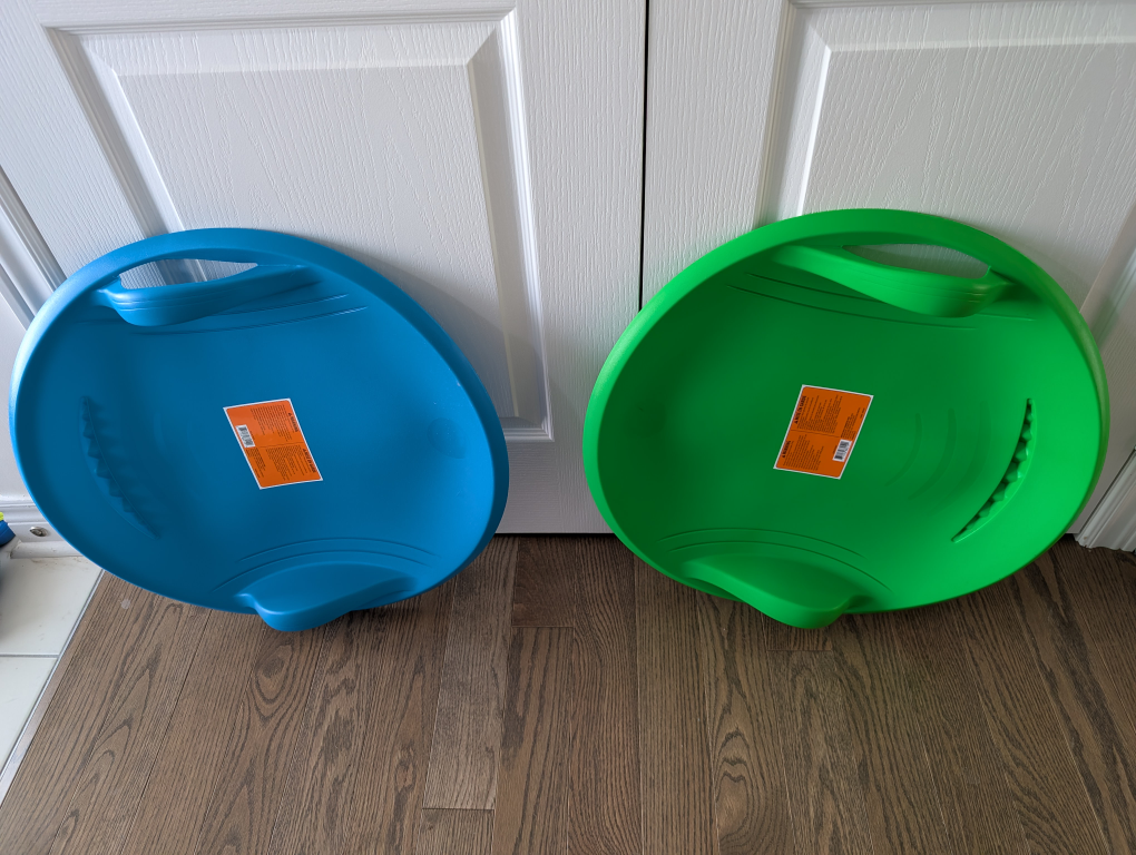Two Plastic Snow Sleds