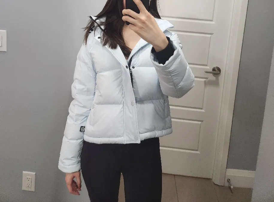 The Super Puff Light Blue Cropped Puffer Jacket with a tag image indicator(5)
