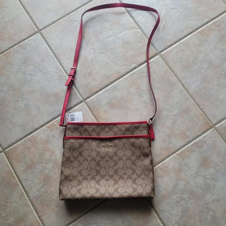 Coach crossbody bag, brown signature canvas with pink accents image indicator(2)