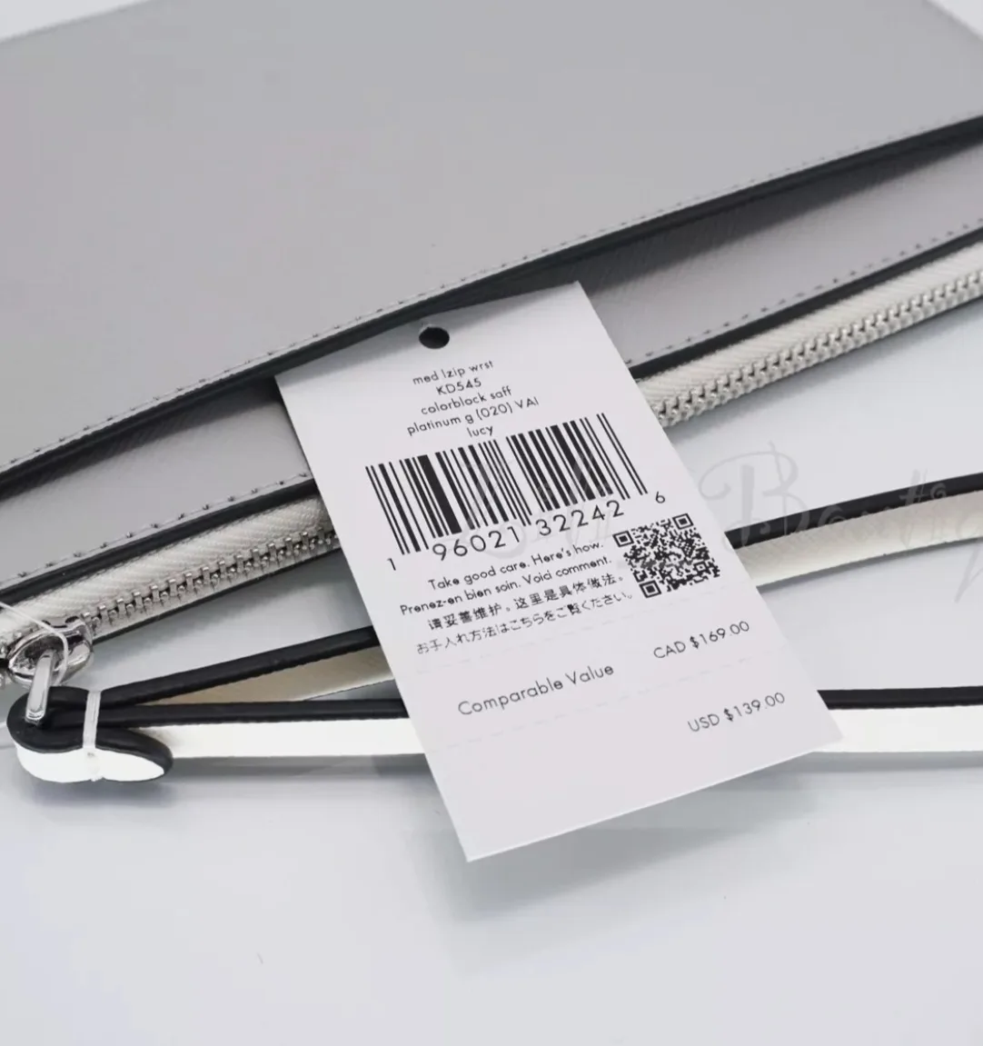 Kate Spade New York Grey and White Wristlet image indicator(2)