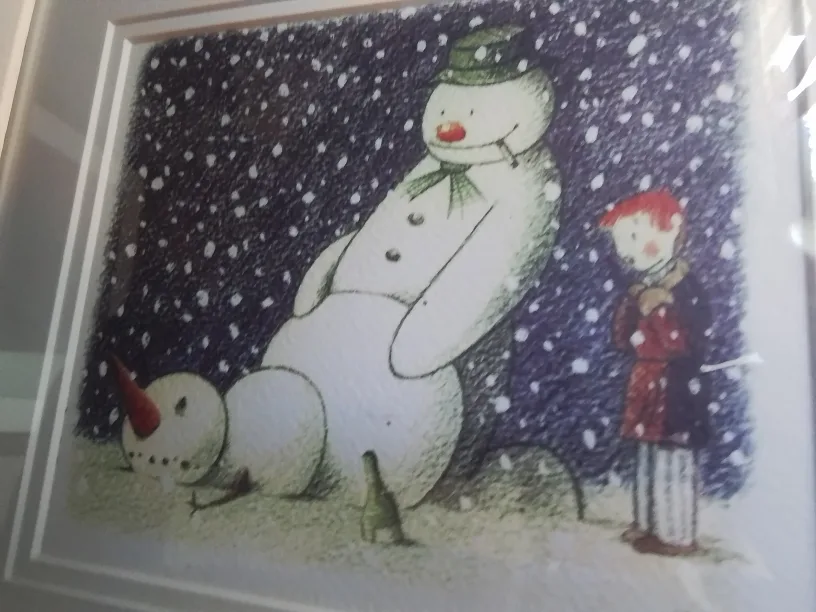 Framed Banksy artwork featuring a mod-d £10 note and a snowman image indicator(4)