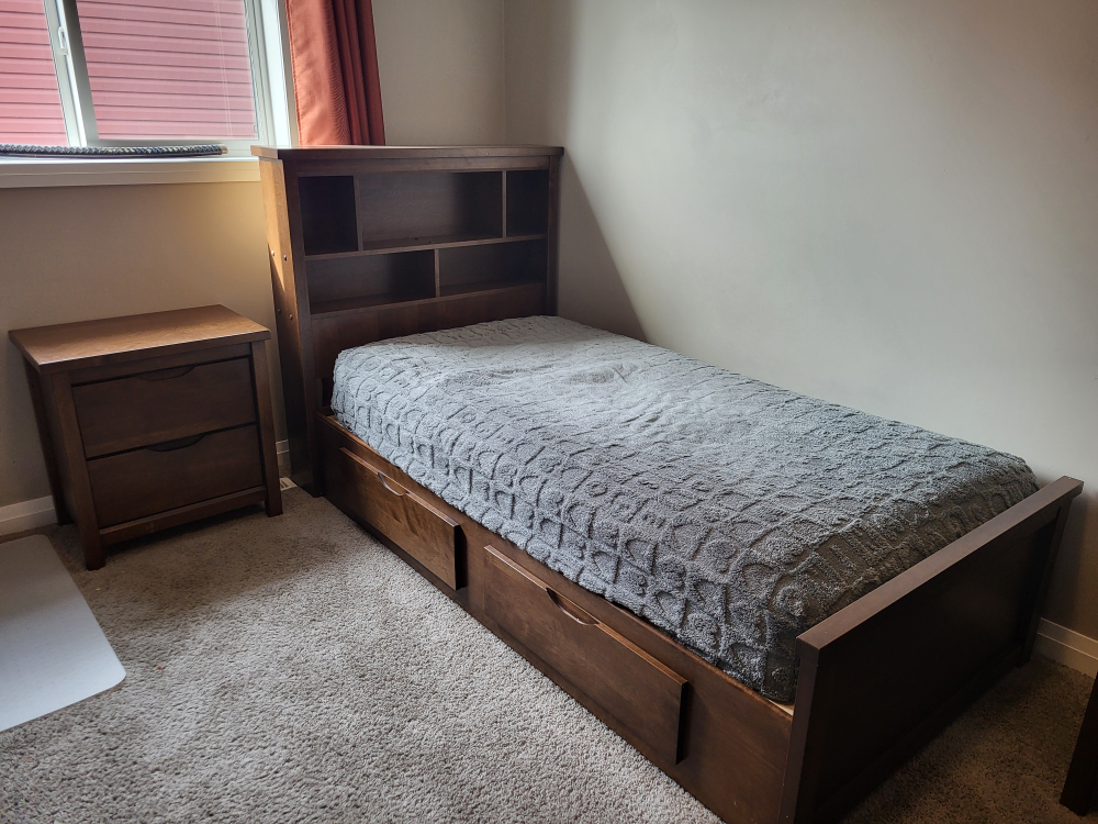 Twin-size bed with built-in headboard and drawers
