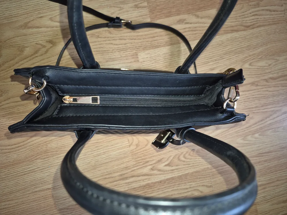 Black quilted satchel handbag with gold chain strap image indicator(4)