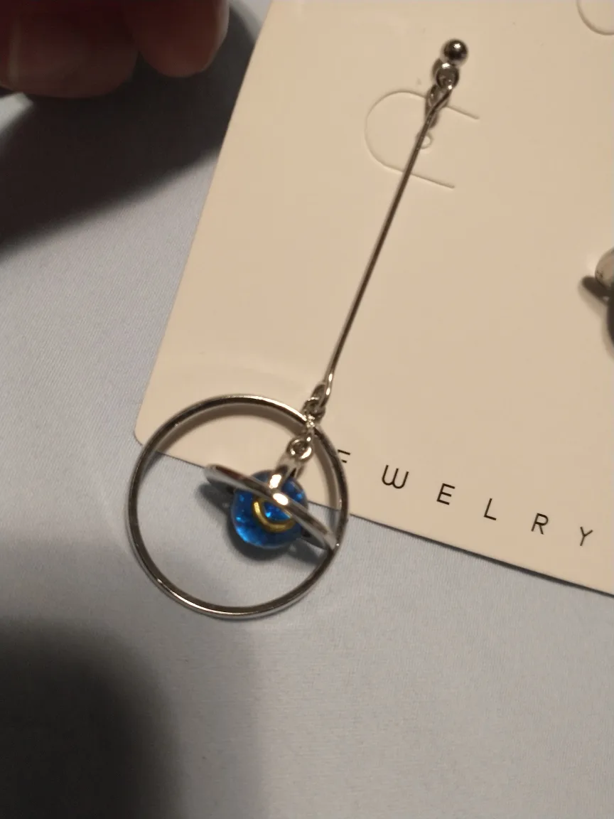 Asymetrical blue and silver star and planet earrings image indicator(3)