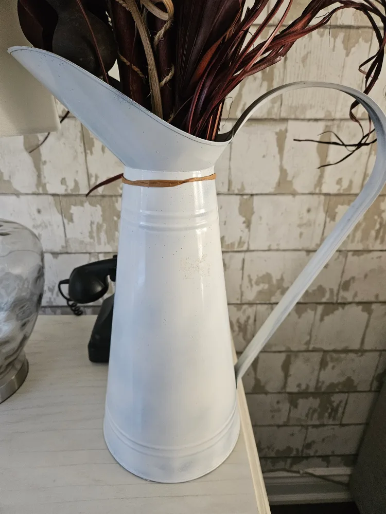 Tall jug with faux flower. image indicator(3)