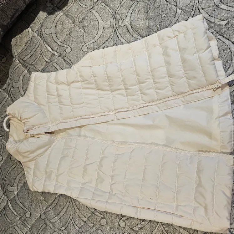 Old Navy Active cream puffer vest image indicator(3)