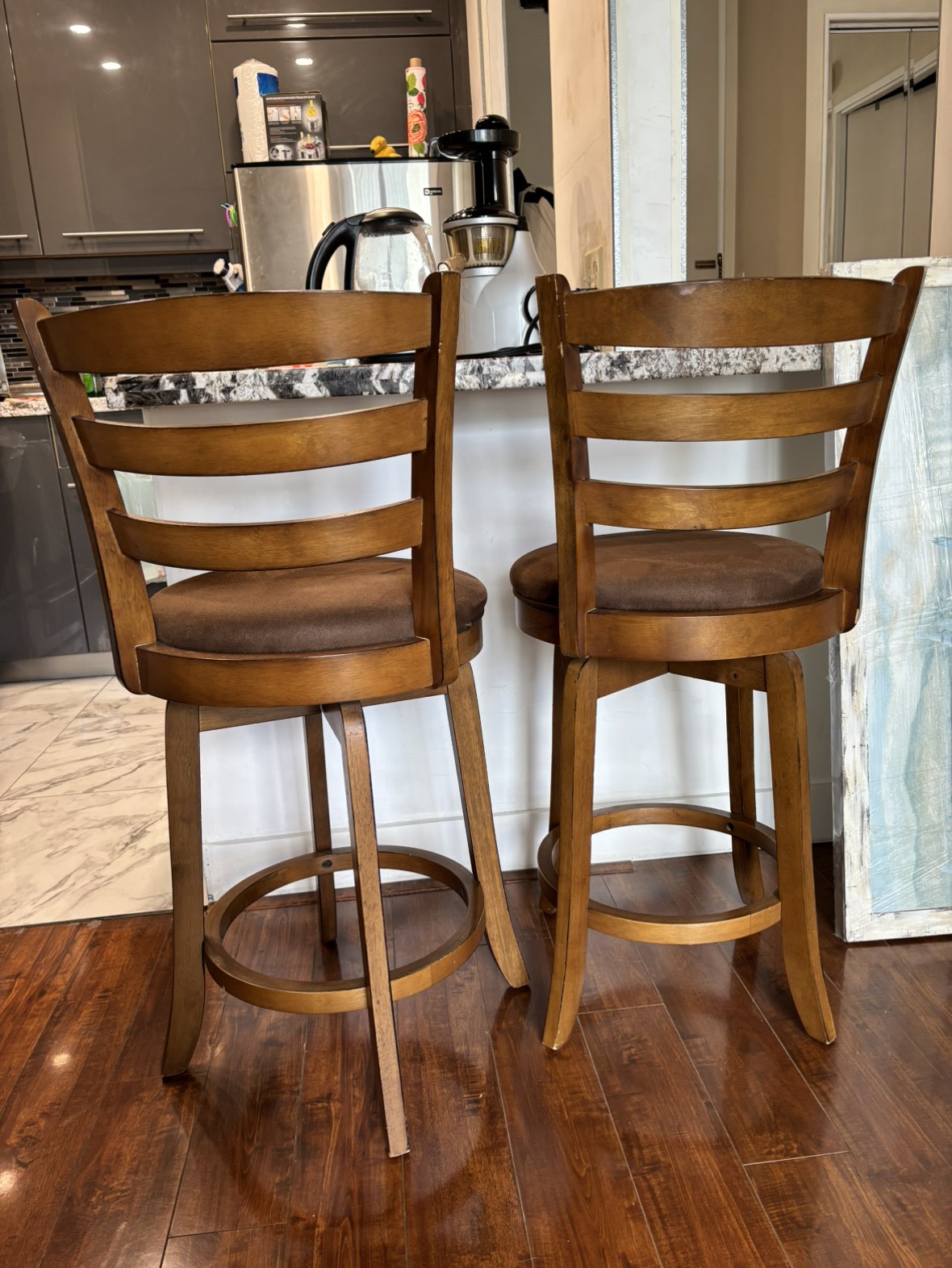 Brown bar stools with a back