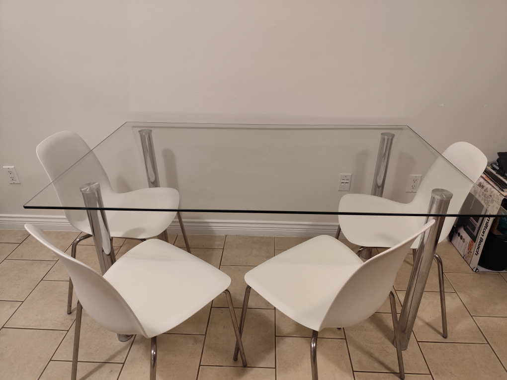 Glass Dining Table with Four White Chairs
