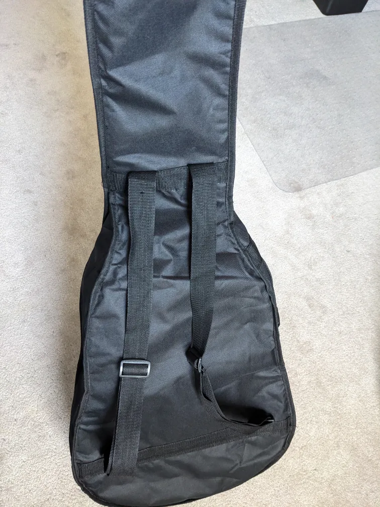 Acoustic guitar with: case, tuner, pick, new strings image indicator(7)