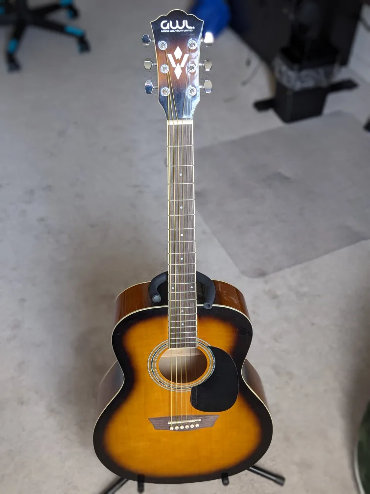 Acoustic guitar with: case, tuner, pick, new strings image indicator(2)