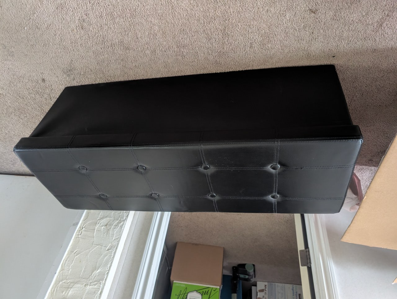 black fold down storage bench
