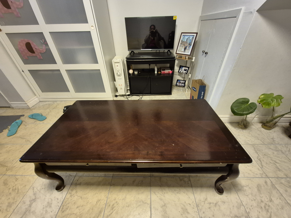 Dark brown wood coffee table with two drawers