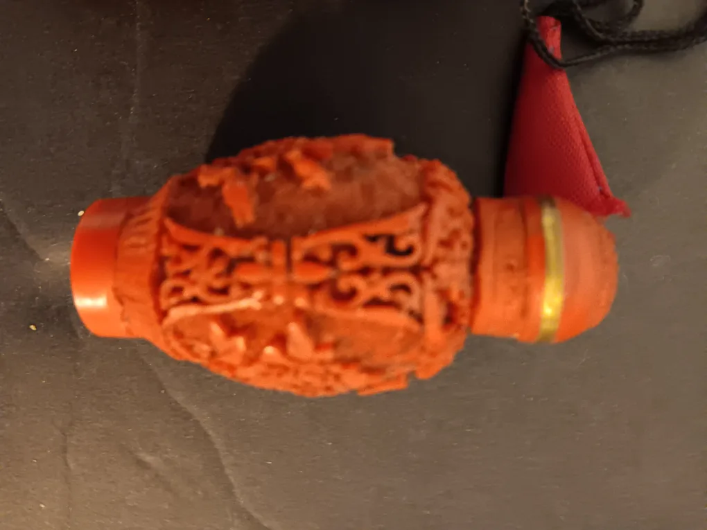 Vintage Chinese Carved Cinnabar Snuff Bottle with Pouch image indicator(2)