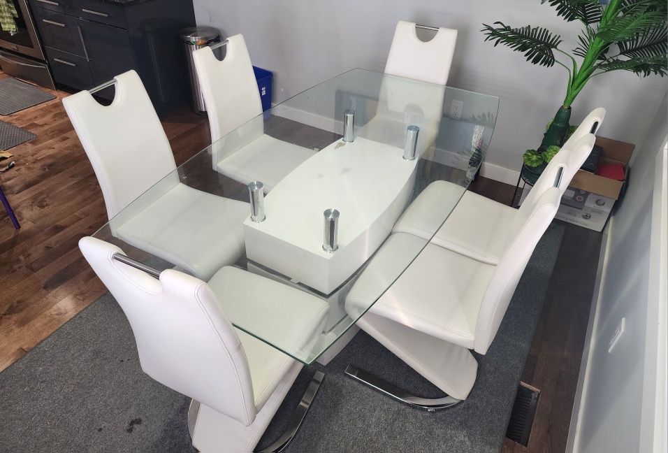 Modern Glass Top Dining Table with Six White Chairs